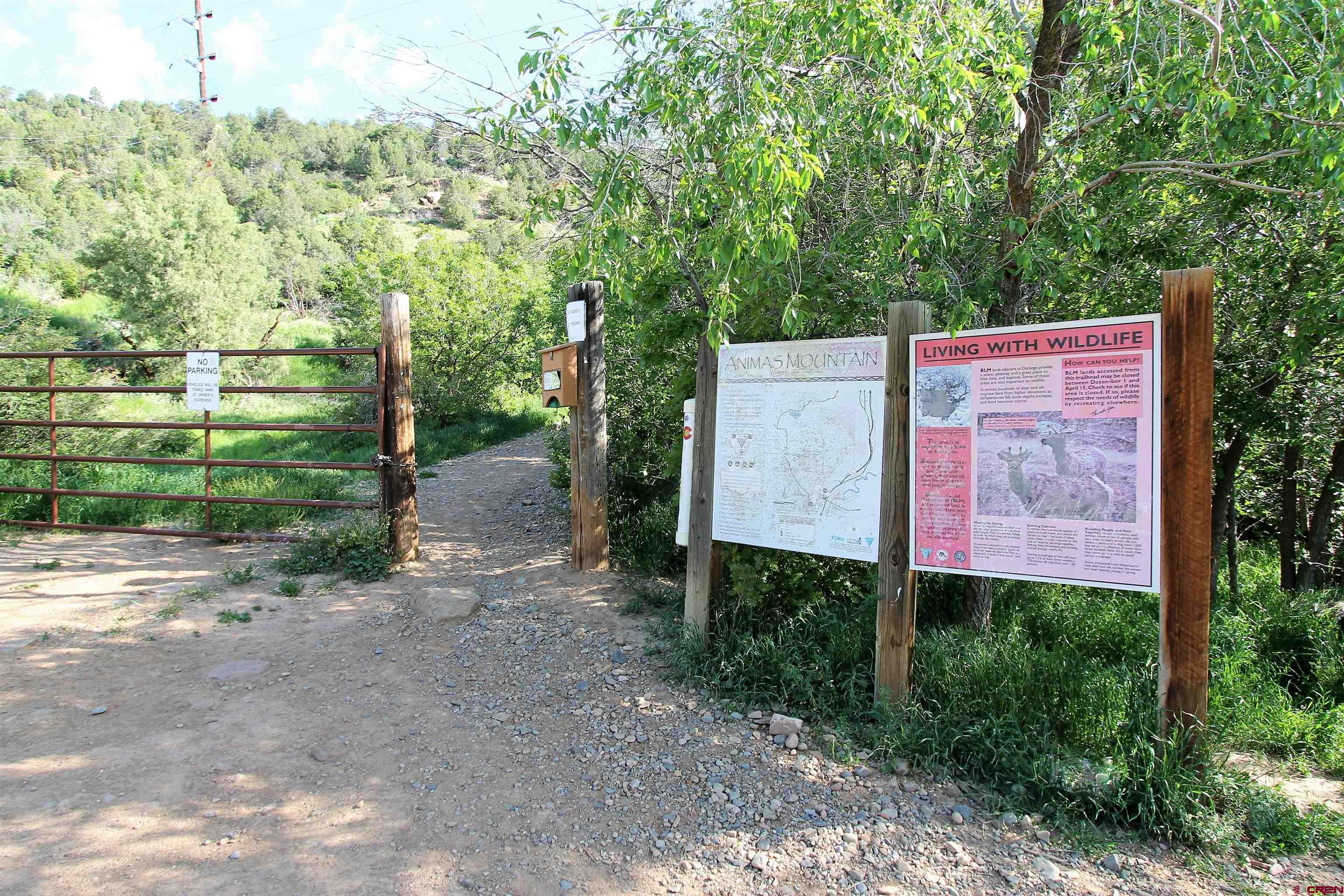 3416 Main Avenue, Unit 203 Durango, CO 81301 - Photo 33 of 34 a sign board with a small yard