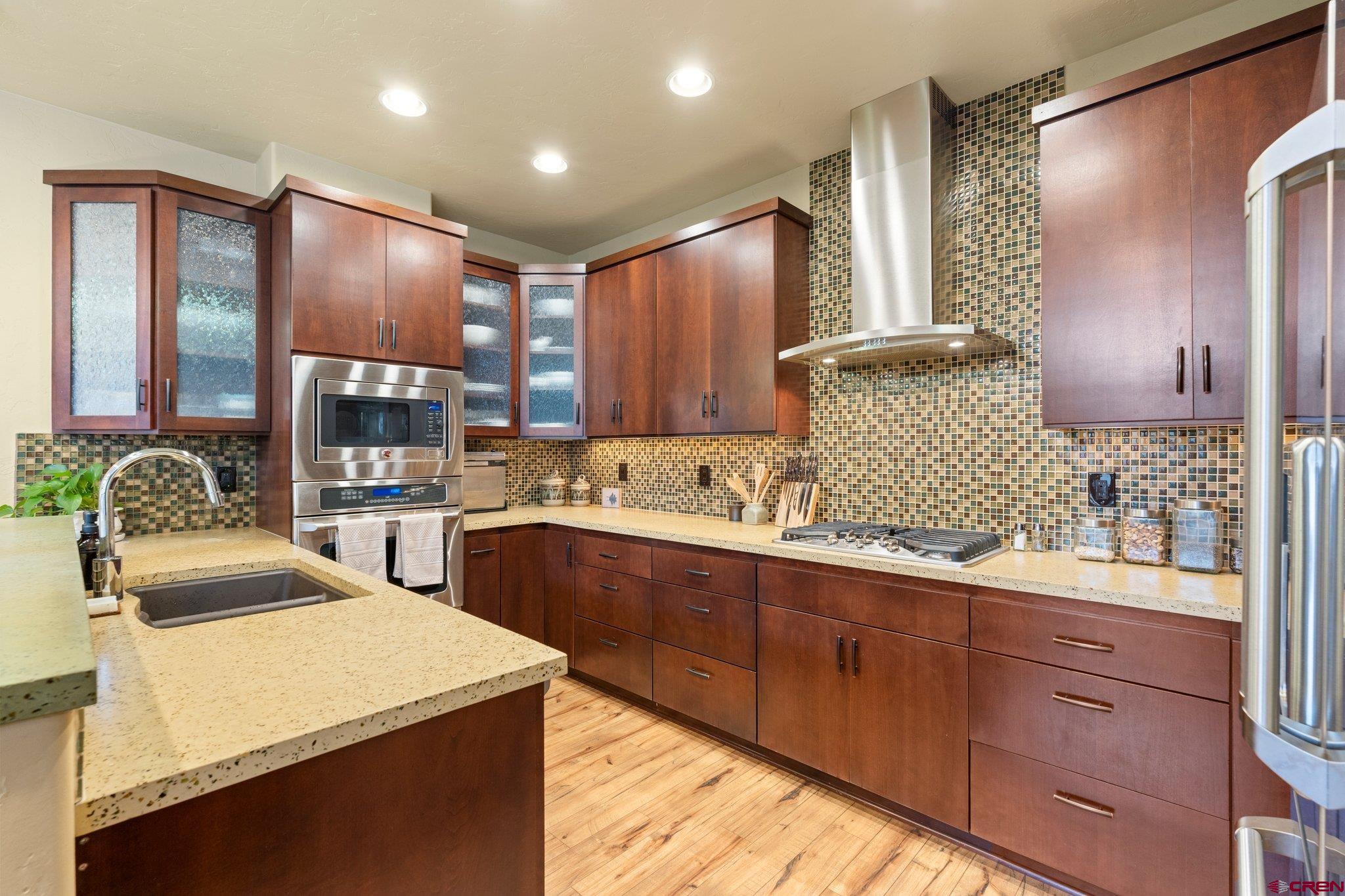 3416 Main Avenue, Unit 203 Durango, CO 81301 - Photo 6 of 34 a kitchen with a sink appliances and cabinets
