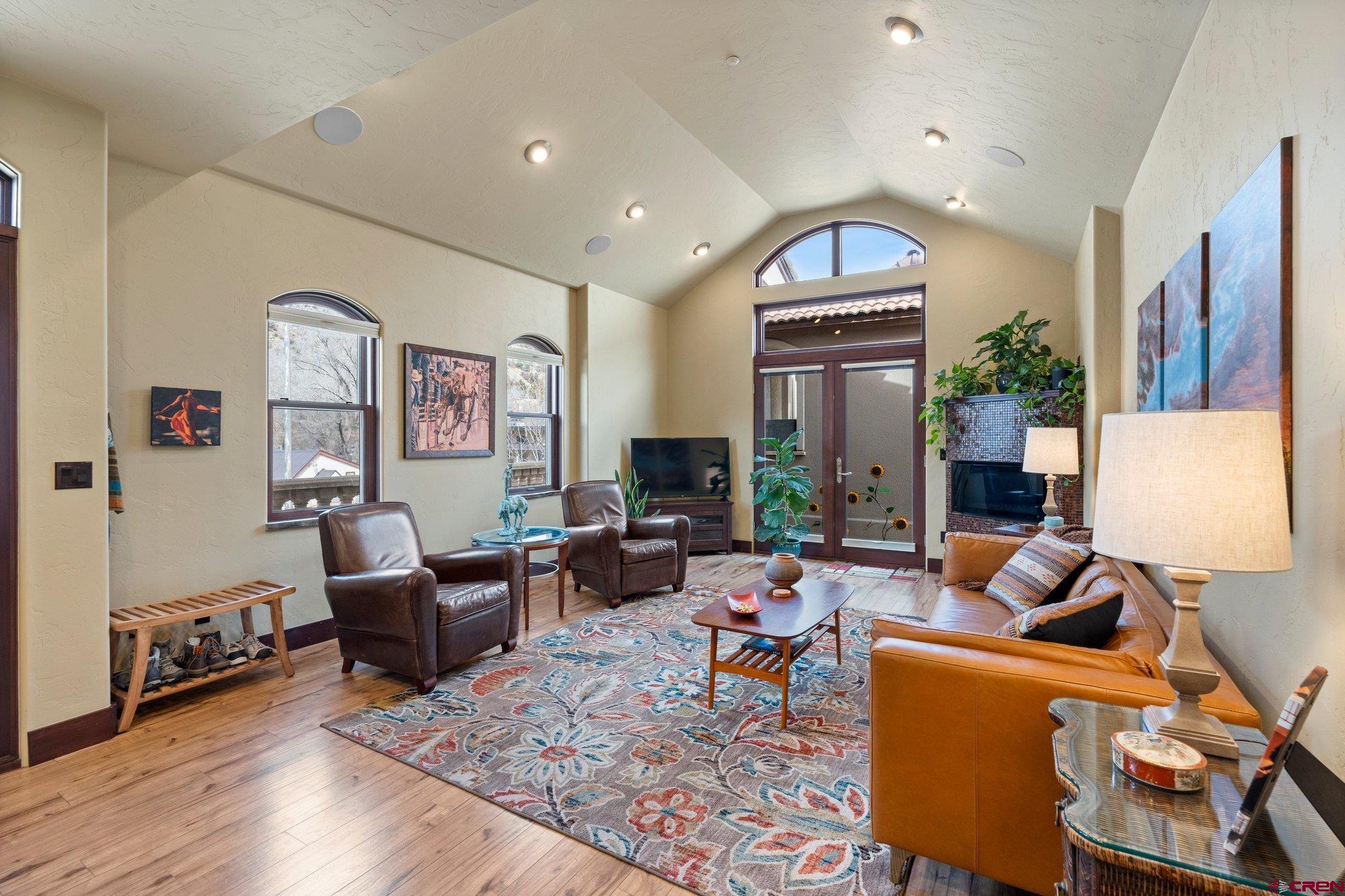 3416 Main Avenue, Unit 203 Durango, CO 81301 - Photo 7 of 34 a living room with furniture fireplace and wooden floor