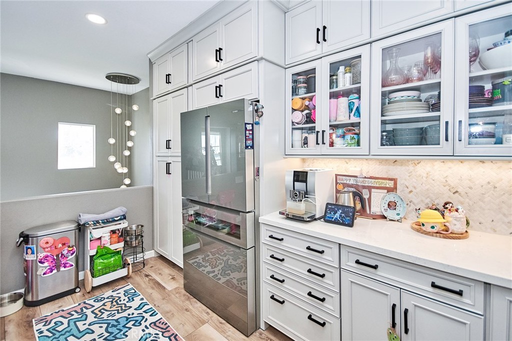 7331 Shelby Place, Unit 8 Rancho Cucamonga, CA 91739 - Photo 14 of 41 a kitchen with stainless steel appliances cabinets and a window