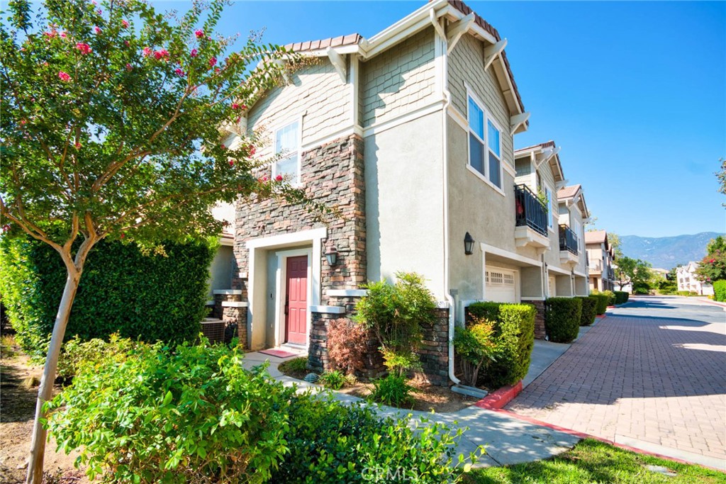 7331 Shelby Place, Unit 8 Rancho Cucamonga, CA 91739 - Photo 2 of 41 a view of a house with a yard