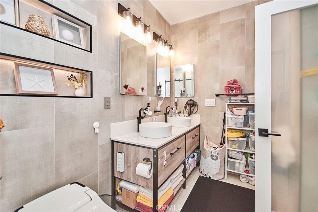 7331 Shelby Place, Unit 8 Rancho Cucamonga, CA 91739 - Photo 25 of 41 a bathroom with a sink mirror vanity and toilet