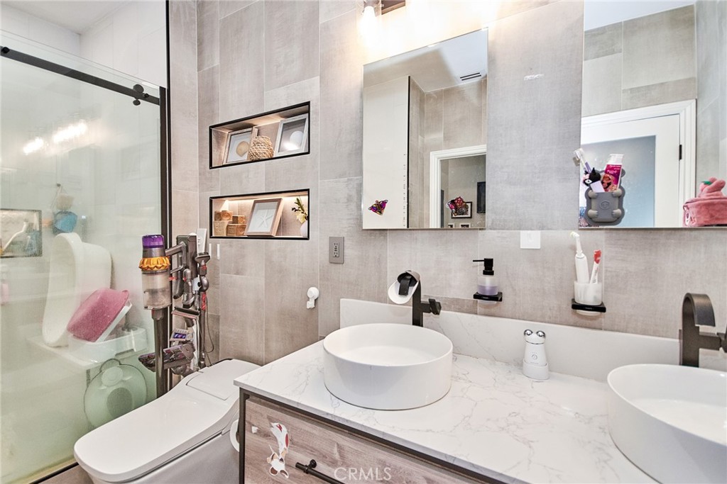 7331 Shelby Place, Unit 8 Rancho Cucamonga, CA 91739 - Photo 26 of 41 a bathroom with a sink toilet and mirror