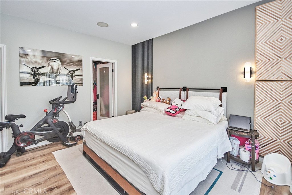 7331 Shelby Place, Unit 8 Rancho Cucamonga, CA 91739 - Photo 29 of 41 a bed room with a bed and a table