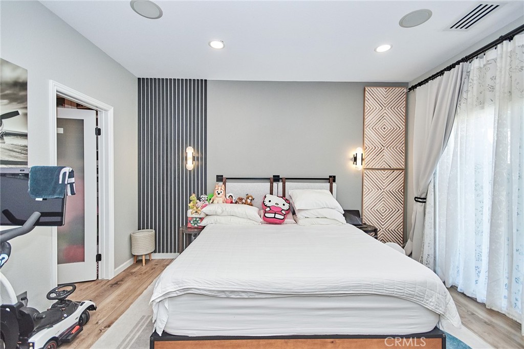 7331 Shelby Place, Unit 8 Rancho Cucamonga, CA 91739 - Photo 30 of 41 a bedroom with a bed and a large mirror