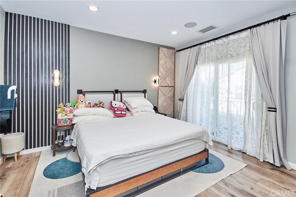 7331 Shelby Place, Unit 8 Rancho Cucamonga, CA 91739 - Photo 31 of 41 a bedroom with a bed and a large mirror