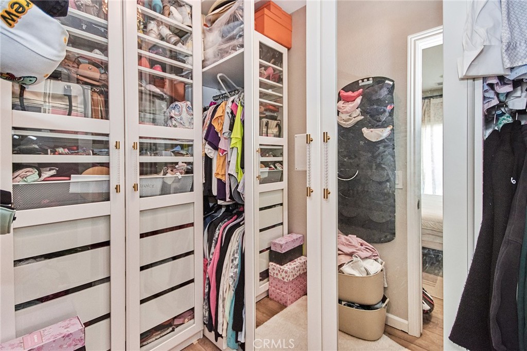 7331 Shelby Place, Unit 8 Rancho Cucamonga, CA 91739 - Photo 32 of 41 a view of walk in closet with clothes and shoes