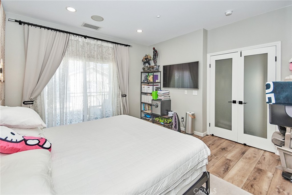 7331 Shelby Place, Unit 8 Rancho Cucamonga, CA 91739 - Photo 33 of 41 a bedroom with a bed and a flat screen tv