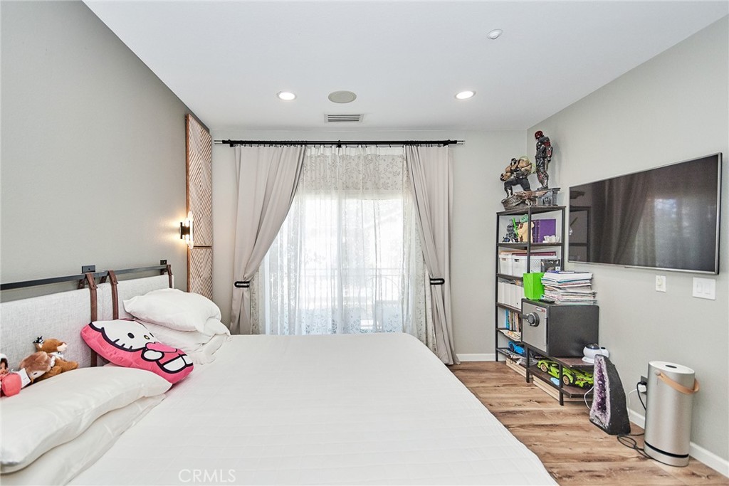 7331 Shelby Place, Unit 8 Rancho Cucamonga, CA 91739 - Photo 34 of 41 a bedroom with a bed and a couch