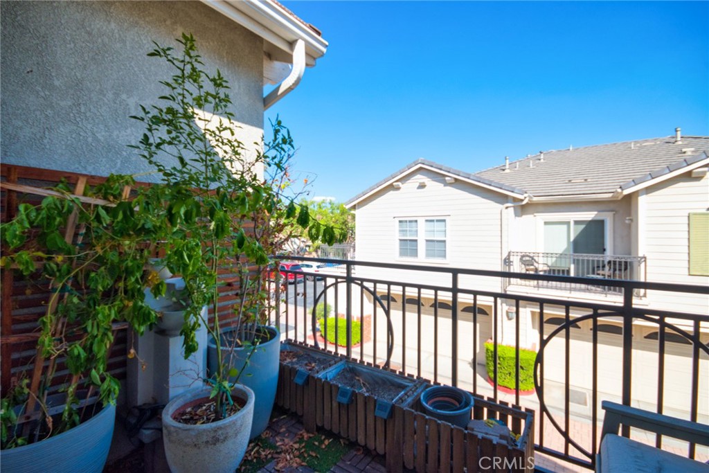 7331 Shelby Place, Unit 8 Rancho Cucamonga, CA 91739 - Photo 35 of 41 a view of a house with wooden deck and furniture