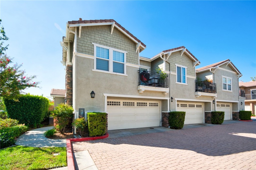 7331 Shelby Place, Unit 8 Rancho Cucamonga, CA 91739 - Photo 37 of 41 a front view of a house with a garden