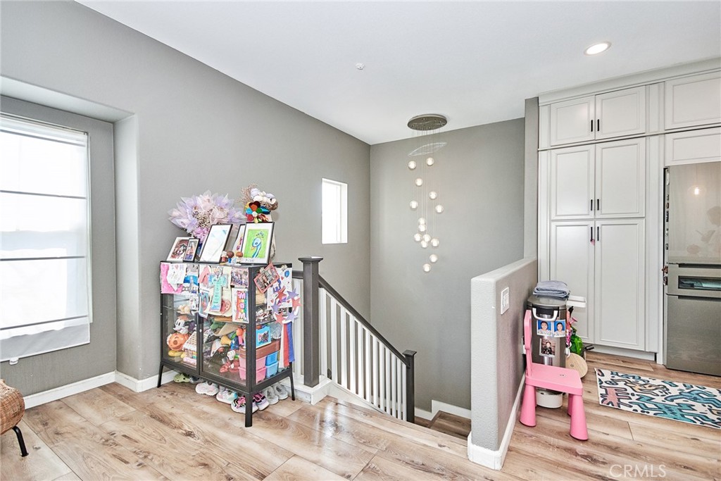 7331 Shelby Place, Unit 8 Rancho Cucamonga, CA 91739 - Photo 5 of 41 a view of an entryway with wooden floor