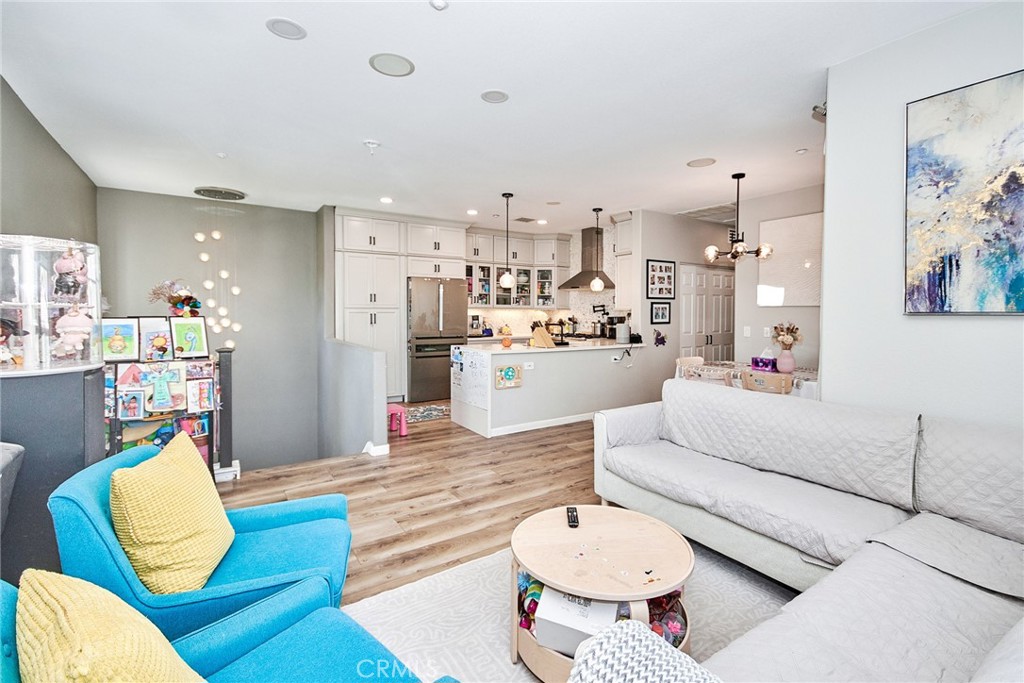7331 Shelby Place, Unit 8 Rancho Cucamonga, CA 91739 - Photo 7 of 41 a living room with furniture and kitchen view