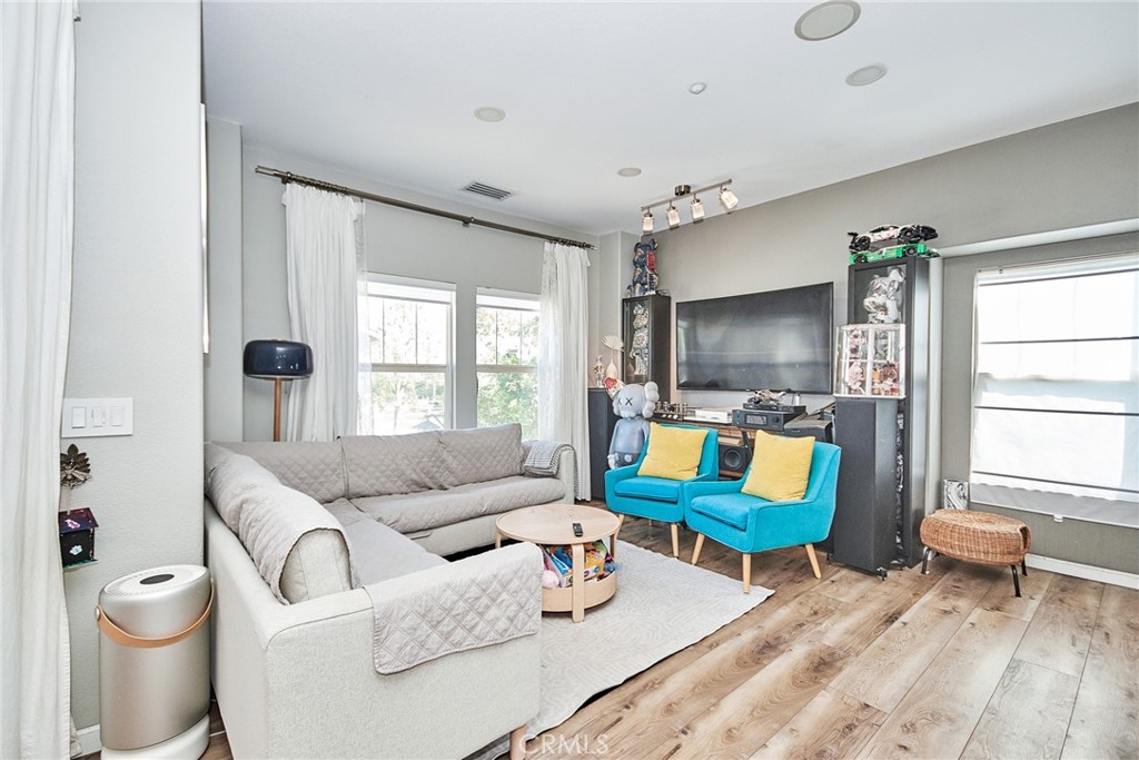 7331 Shelby Place, Unit 8 Rancho Cucamonga, CA 91739 - Photo 8 of 41 a living room with furniture and a window