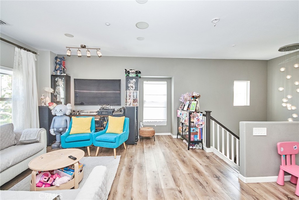7331 Shelby Place, Unit 8 Rancho Cucamonga, CA 91739 - Photo 9 of 41 a living room with furniture and a flat screen tv