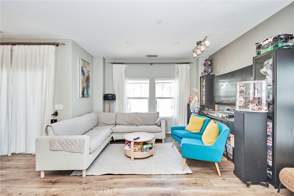 7331 Shelby Place, Unit 8 Rancho Cucamonga, CA 91739 - Photo 10 of 41 a living room with furniture and a large window