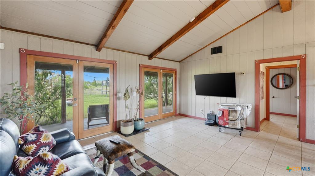 127 Offer Llano, TX 78643 - Photo 15 of 40 Vaulted ceiling with exposed wood beams
