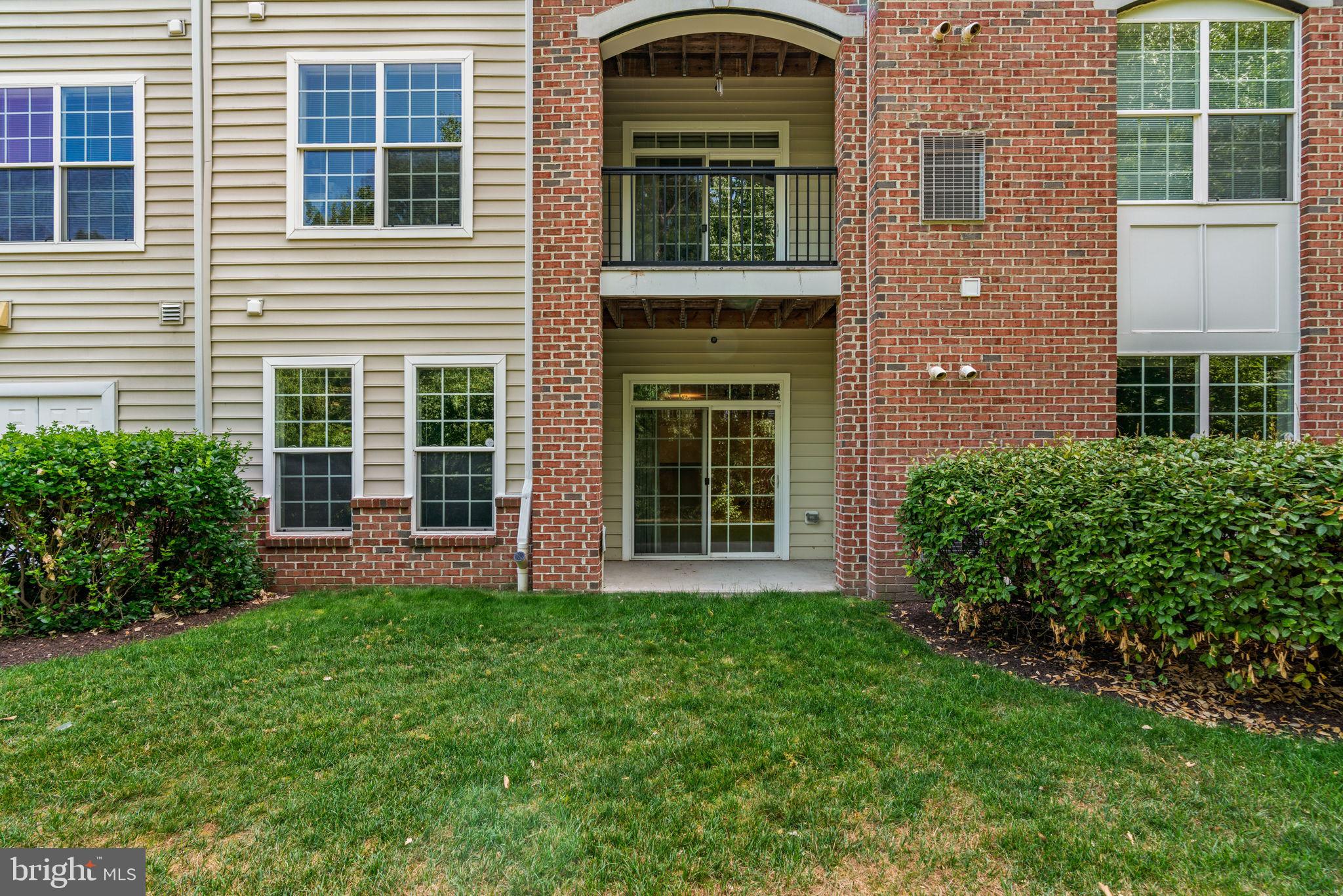 7315 Maplecrest Road, Unit 104 Elkridge, MD 21075 - Photo 46 of 58 a view of front of a house with a yard