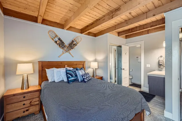 a bedroom with a bed and a lamp