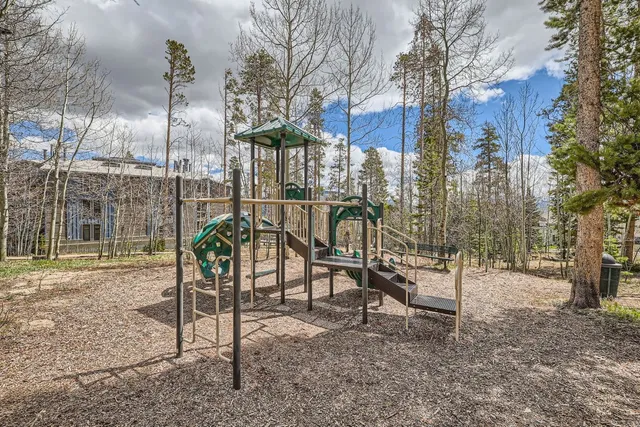 a view of a brick house with many windows