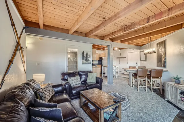 a living room with furniture and a rug