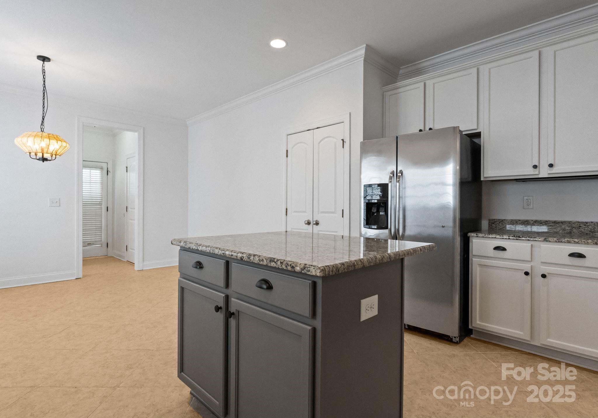 20237 Harroway Drive Cornelius, NC 28031 - Photo 12 of 23 a kitchen with stainless steel appliances granite countertop a sink a refrigerator and a stove