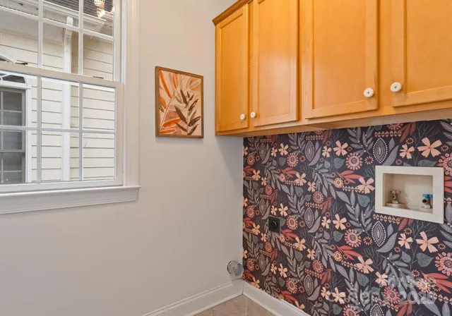 a bathroom with a window and a shower