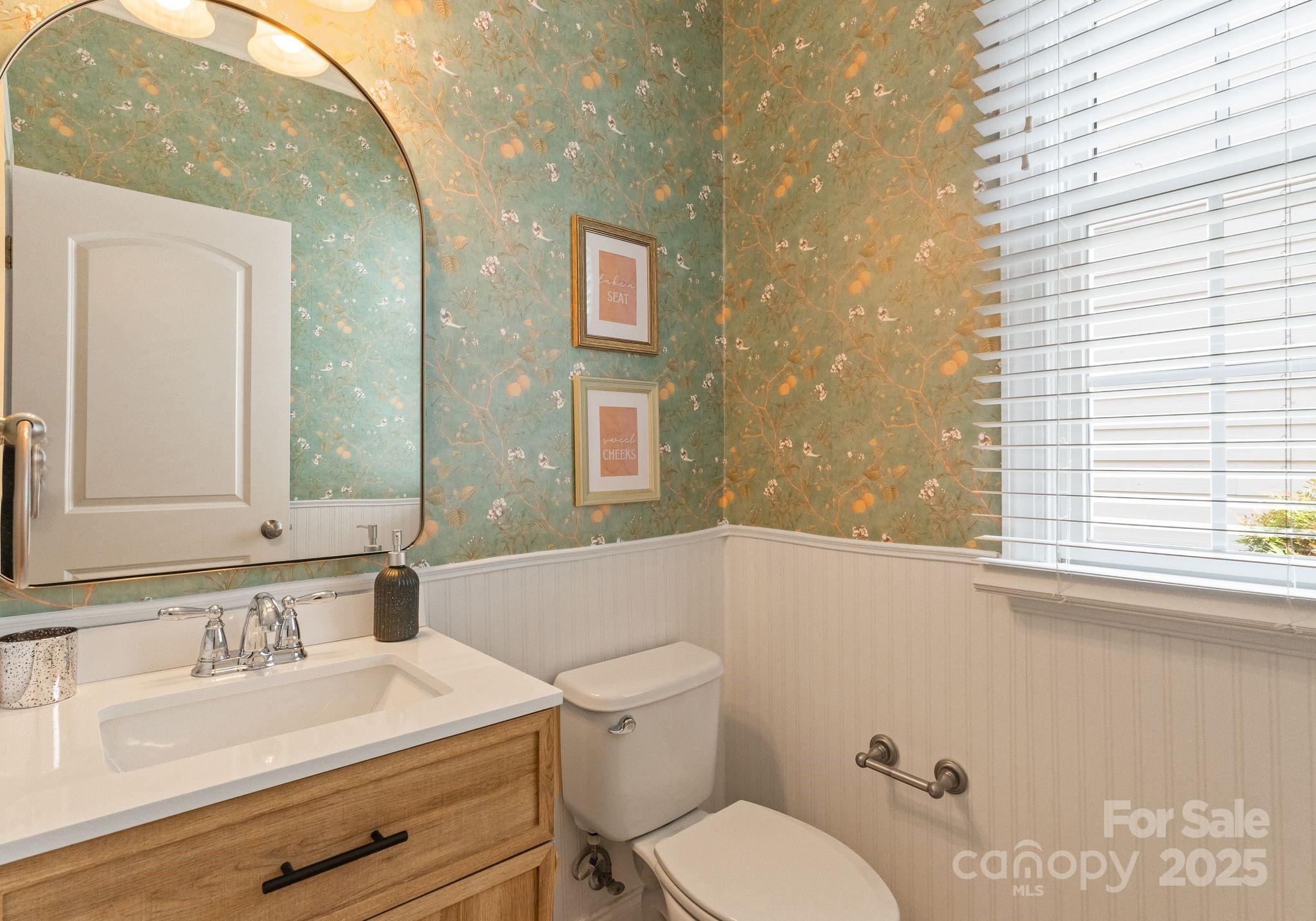 20237 Harroway Drive Cornelius, NC 28031 - Photo 15 of 23 a bathroom with a granite countertop sink mirror vanity and toilet