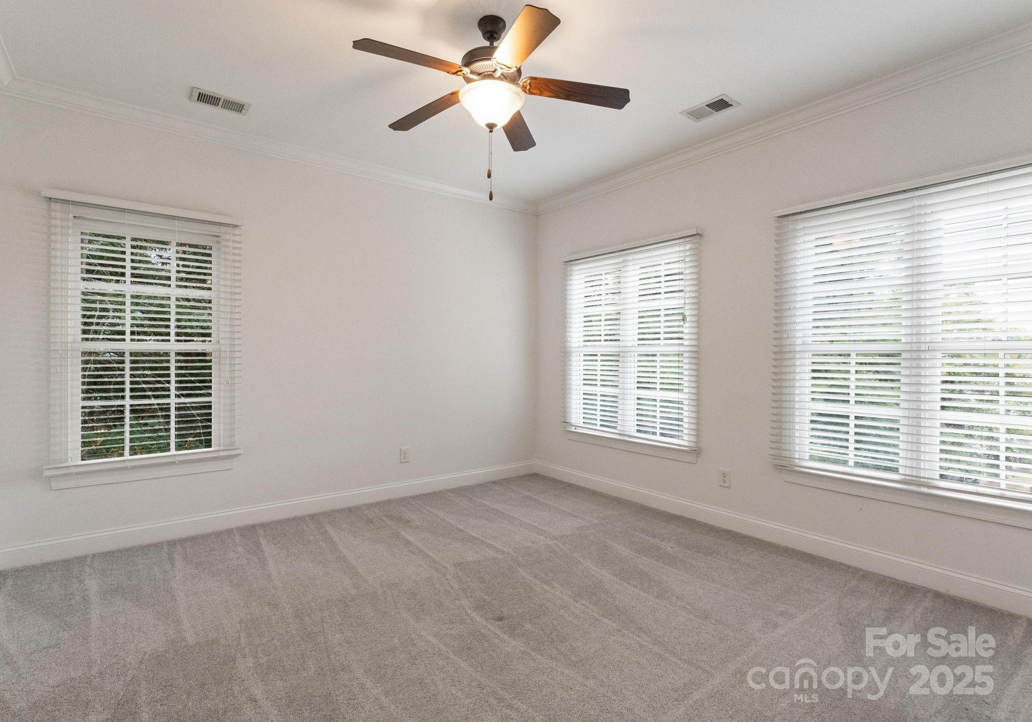20237 Harroway Drive Cornelius, NC 28031 - Photo 20 of 23 a view of an empty room with a window and a ceiling fan