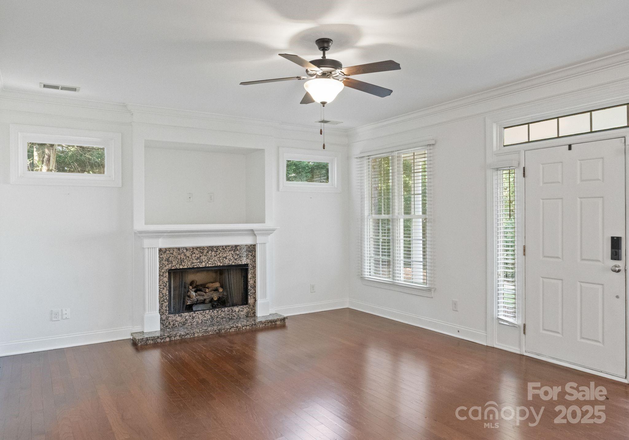 20237 Harroway Drive Cornelius, NC 28031 - Photo 6 of 23 an empty room with windows and fireplace