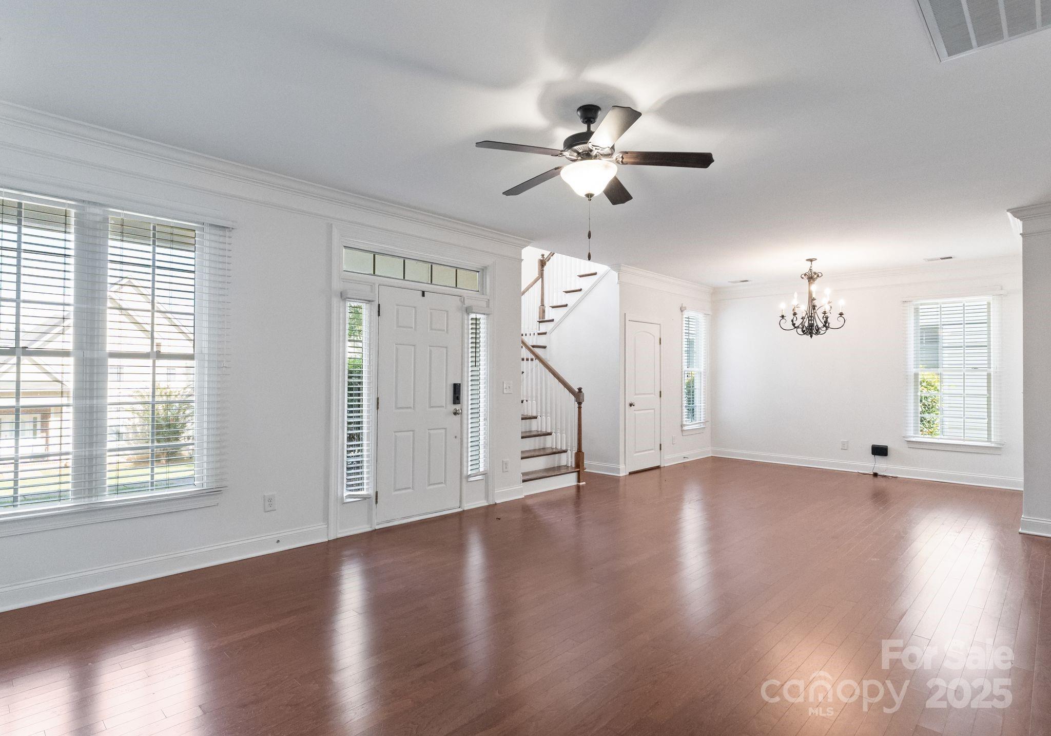 20237 Harroway Drive Cornelius, NC 28031 - Photo 7 of 23 a view of an empty room with wooden floor and a window