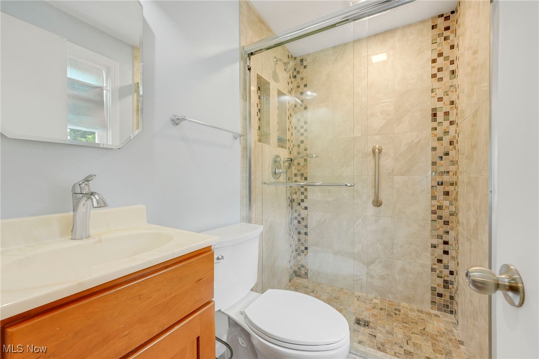 7375 Som Center Road Solon, OH 44139 - Photo 12 of 30 Updated bath complete with a sharp tiled shower and glass doors