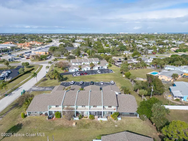 an aerial view of a house with a garden