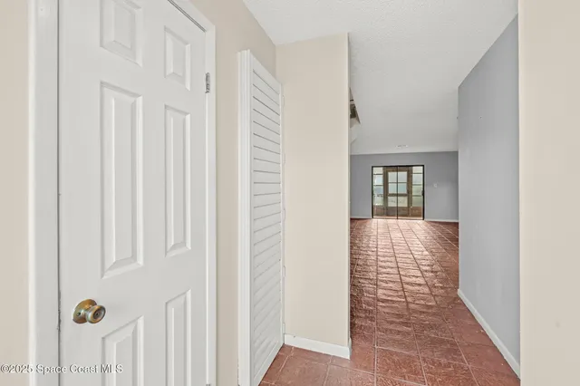 a kitchen with a refrigerator and a sink
