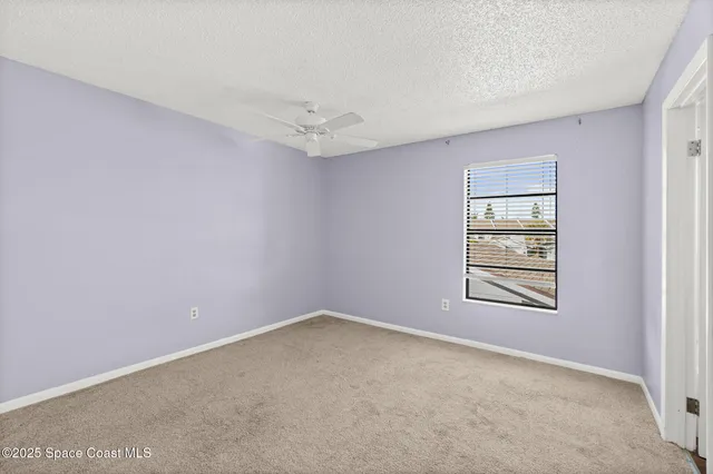 a white bath tub sitting next to a window