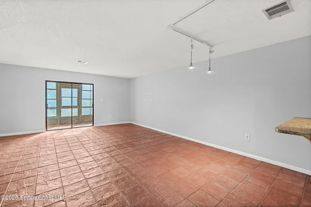 a view of empty room with windows