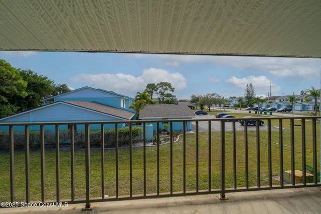 a balcony with a garden view
