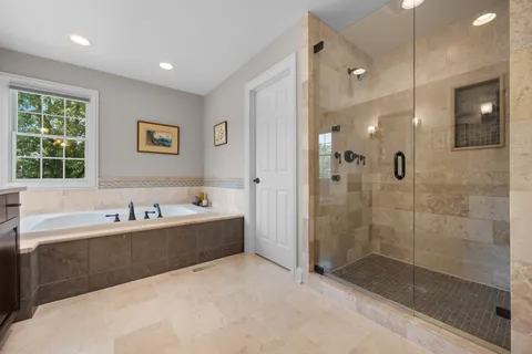 a bathroom with a bathtub and a sink