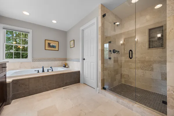 a bathroom with a bathtub and a sink