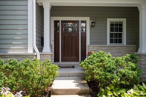 a front view of a house with a yard