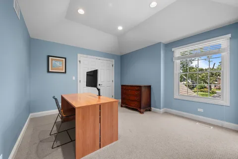 a view of workspace with furniture and window