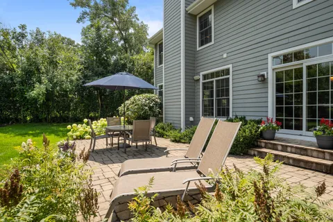 a view of a chair and table in the patio