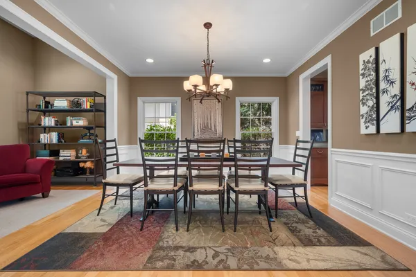 a view of a dining room with furniture window and wooden floor