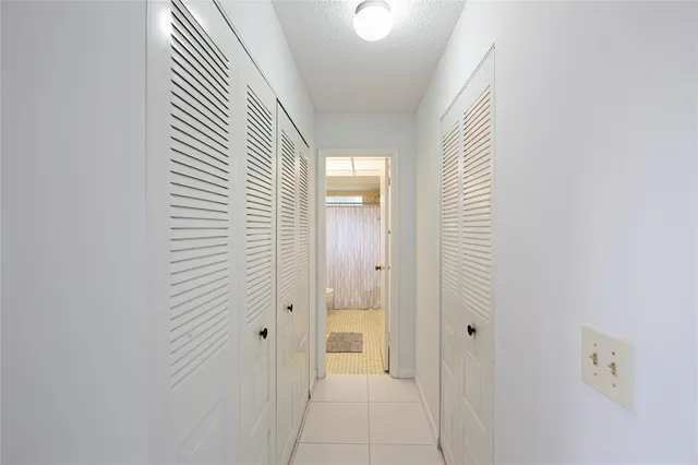 a view of a hallway with a wooden floor
