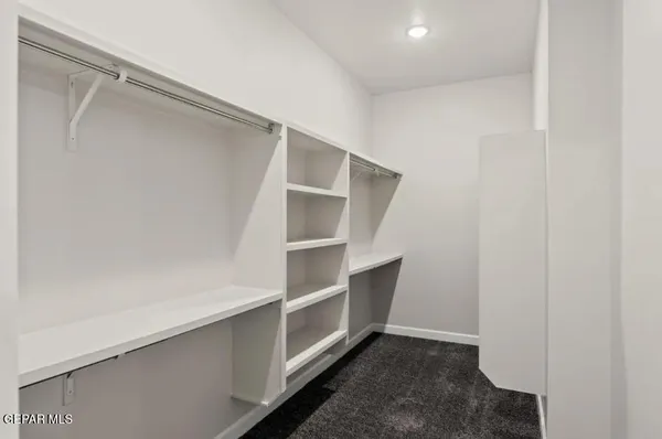 a view of an empty walk in closet