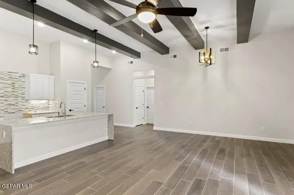 a view of a kitchen with wooden floor