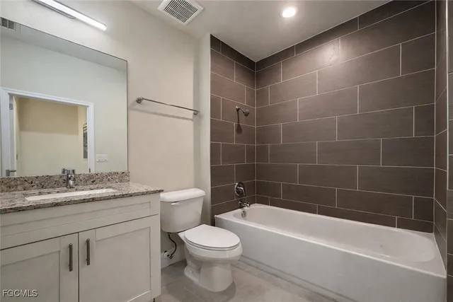 a bathroom with a bathtub a toilet a sink and shower