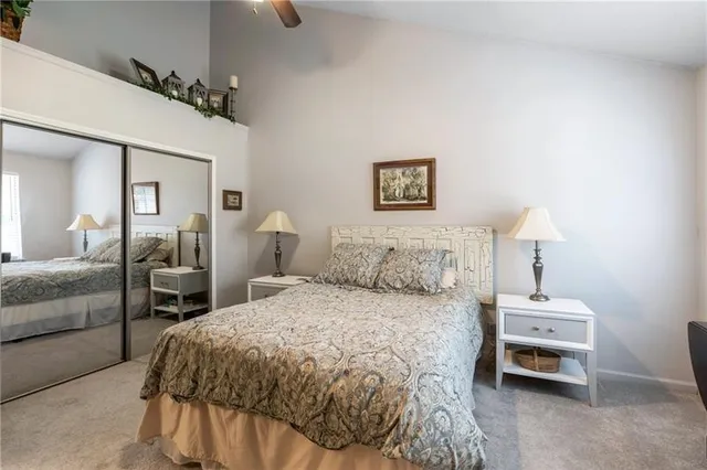 a bedroom with a bed and a lamp