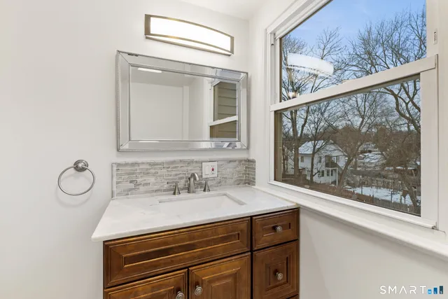 a bathroom with a sink and a mirror