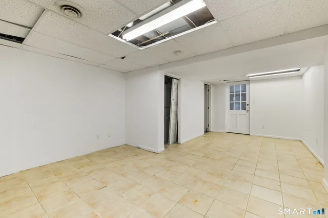 a view of an empty room with empty shelves
